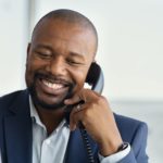 Mature black business man talking on phone